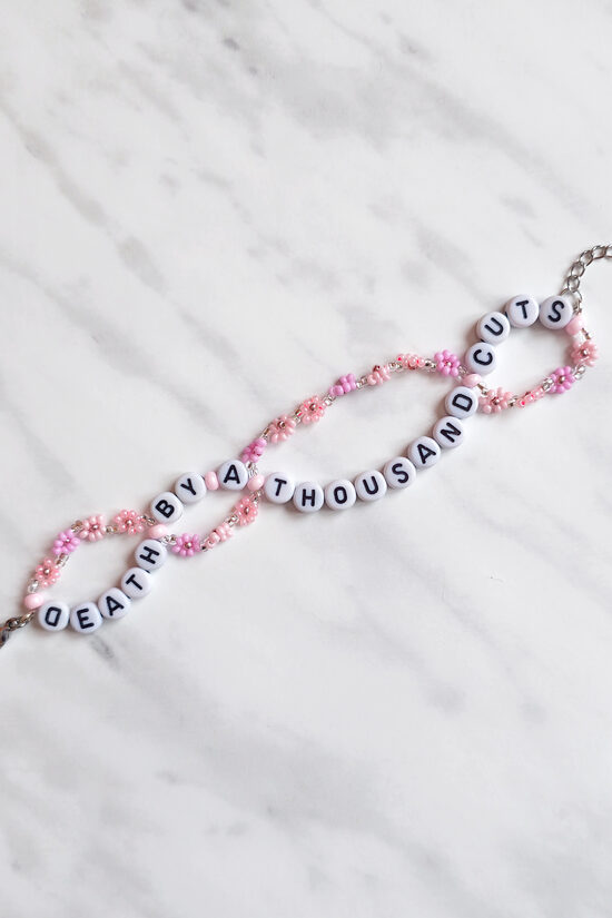 Death By A Thousand Cuts Bracelet with upside down letter D